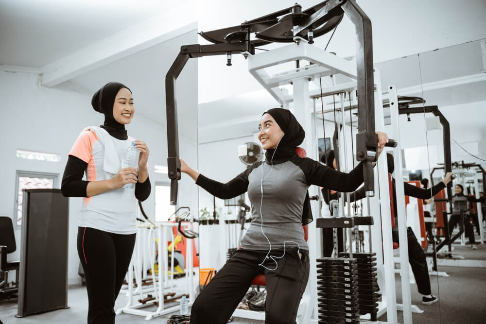 muslim women training with weights